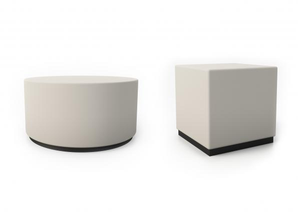 Two white ottomans, one round and one cubed, on a white background.