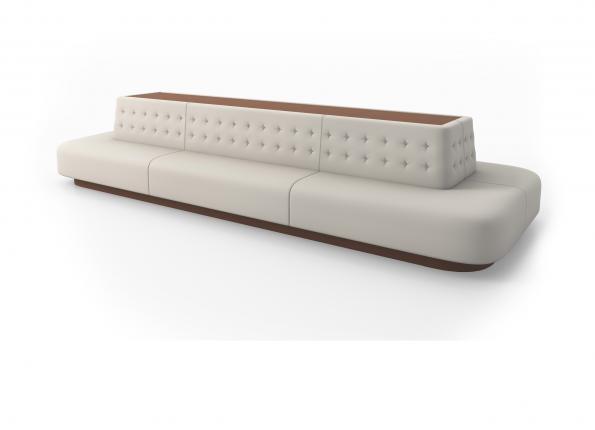 A long white modern couch on a white background.